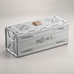Compact grey portable storage container case with mechanical sci-fi styling and copper latch closed.