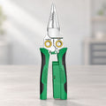 Green and black 8-in-1 multifunction electrician pliers standing upright on a grey tabletop.